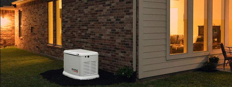 A home standby generator installed next to a house