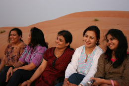 Ladies enjoying the view of the camp from atop a dune